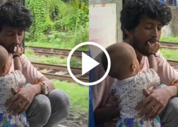 এটি কণমানিয়ে স্থানীয় ৰে’লত মৰমেৰে খুৱাই আছে দেউতাকক! ভাইৰেল ভিডিঅ’ই মন মুহিছে সকলোৰে